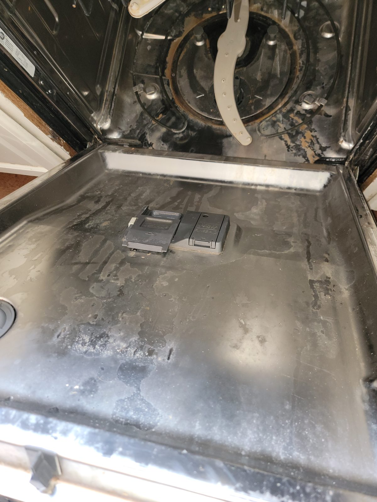 Dirty dishwasher interior, second view