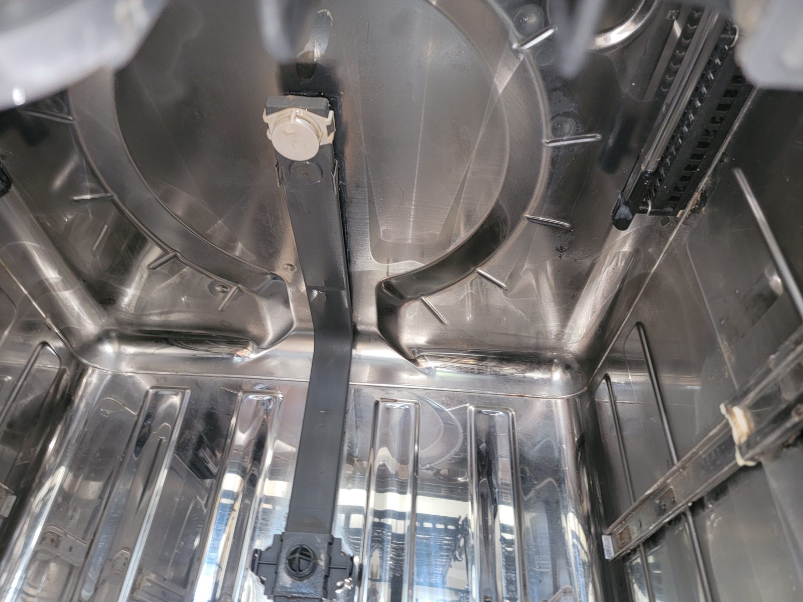 Dirty dishwasher interior after cleanup