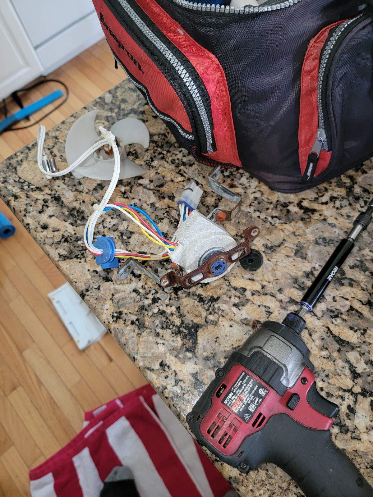 Disassembled refrigerator condenser fan motor