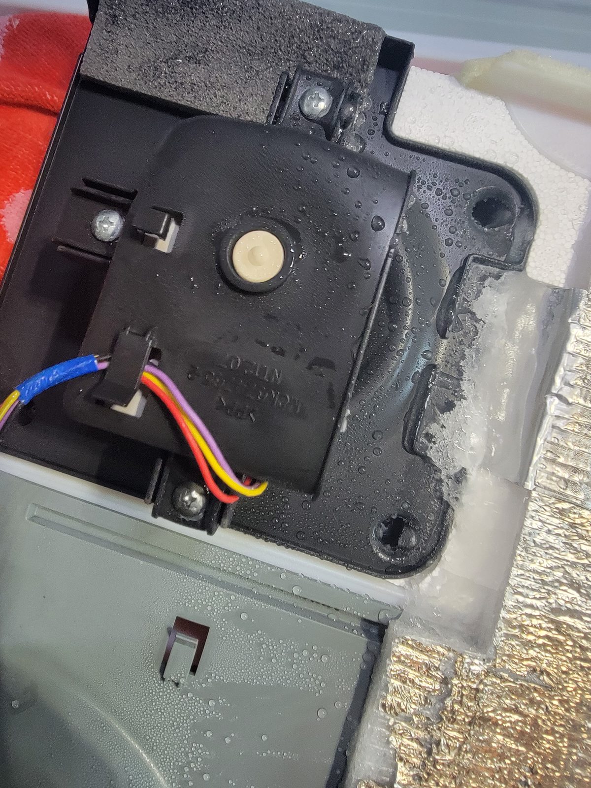 Water and ice soaked refrigerator electronics