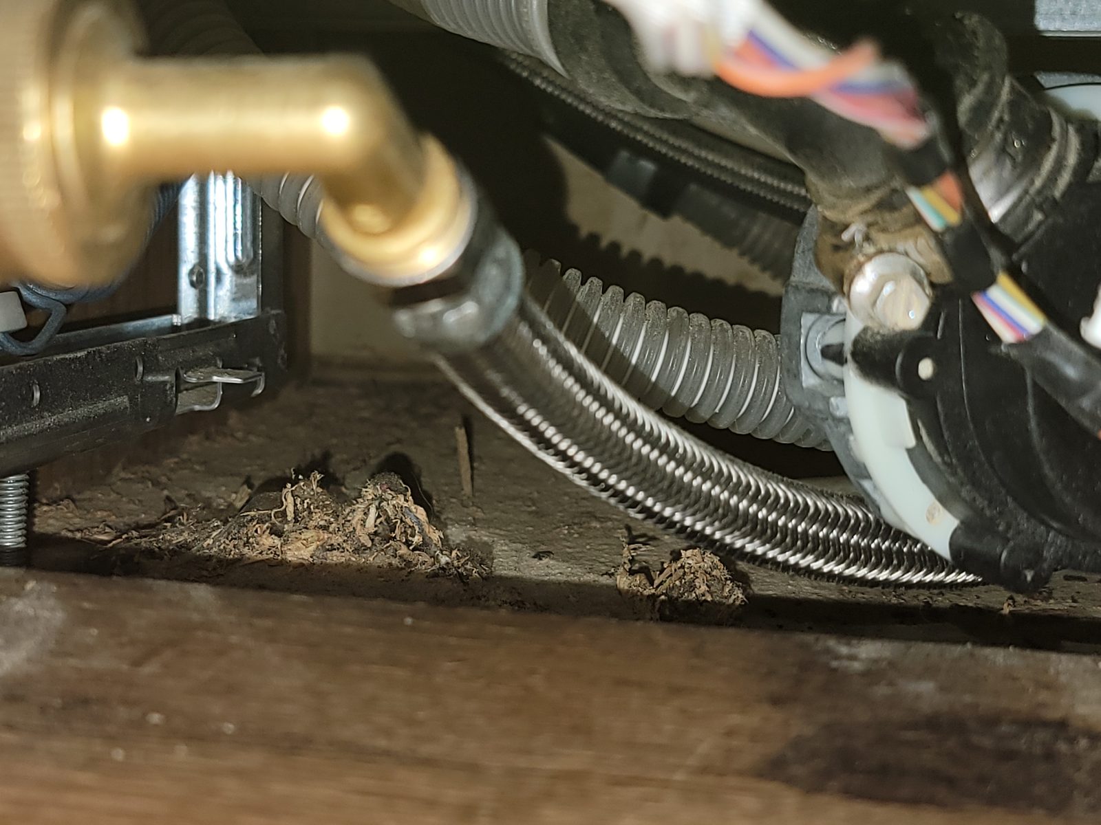 Close-up of a leaking pump and floor damage